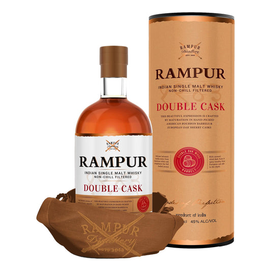 Rampur Double Cask single malt whiskey bottle from LiquorDay with amber liquid in a glass.