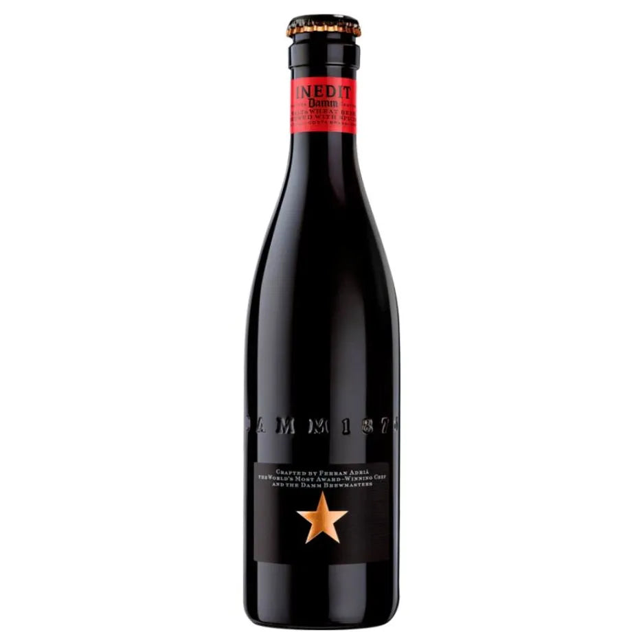 Pack of 24 Estrella Damm Inedit beer bottles, 330ml each, by Paramount, shown in a clear image with bottles lined up.