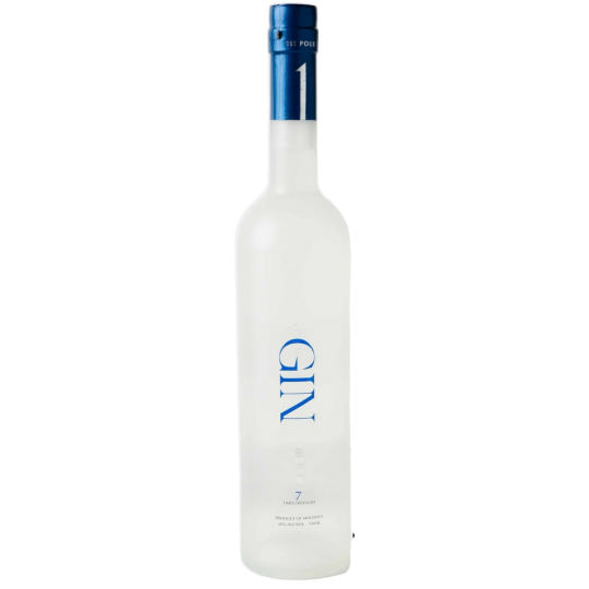Bottle of 1st Pour Paramount International Gin, 700ml with clear label and elegant design, on a wooden surface.