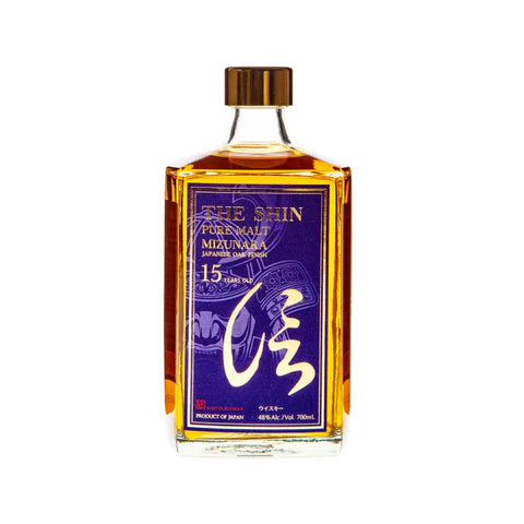 JQWS Shin Pure Malt 15 Year Old whisky bottle, 700mL with a dark label and gold accents, on a wooden surface.