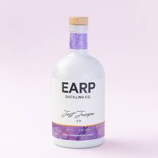 Bottle of Earp Distilling Co. Just Juniper Australian Dry Gin in clear 700ml glass bottle with label and cap, on a plain background.