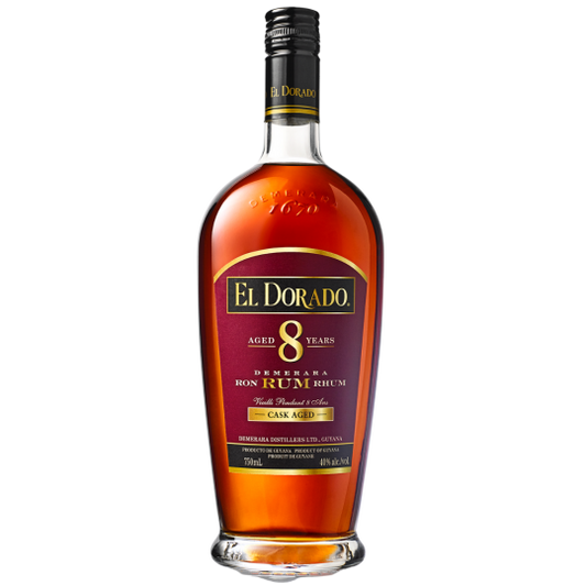 A bottle of LiquorDay El Dorado aged 8 years Demerara Rum with a dark label and gold accents, shown on a wooden surface.