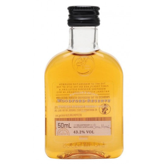 Miniature bottles of Woodford Reserve whisky, 10 x 50ml, displayed in a clear view, showcasing the liquor's branding and packaging.