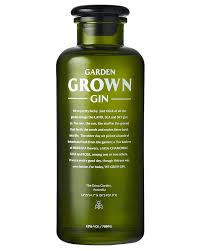 Australian dry gin in a 700mL bottle, Paramount Grown Spirits Original Garden Grown Gin with botanicals and clear liquid.