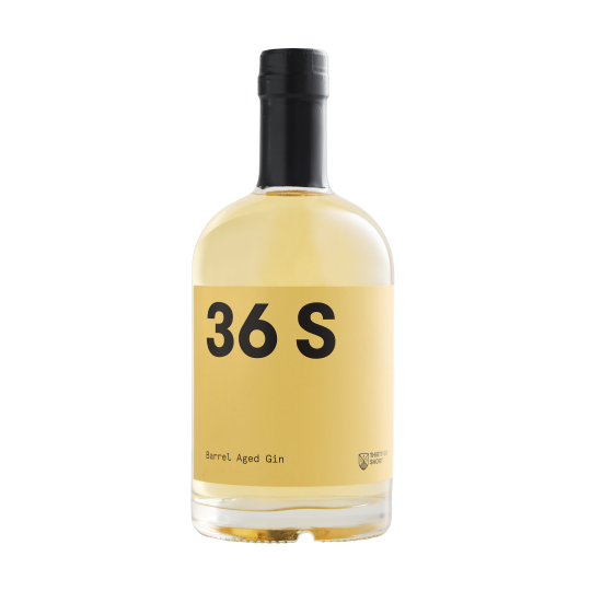 Barrel aged Paramount 36 Short Barrel Original Gin in a 500ml bottle with a clear label and amber-colored liquid inside.