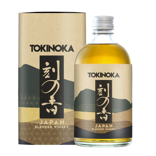 Bottle of Tokinoka White Oak Blended Japanese Whisky by Paramount, 500ml, with a white label and wooden cap on a wooden background.