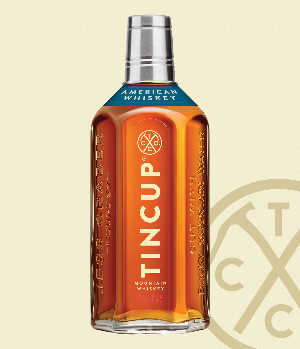 Bottle of Paramount Tincup Blended American Whiskey, 700mL, featuring a clear label and amber-colored bourbon inside.