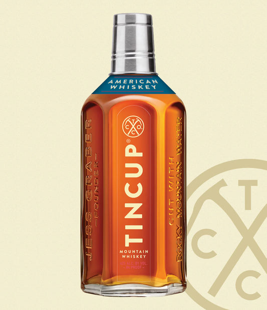 Bottle of Paramount Tincup Blended American Whiskey, 700mL, featuring a clear label and amber-colored bourbon inside.