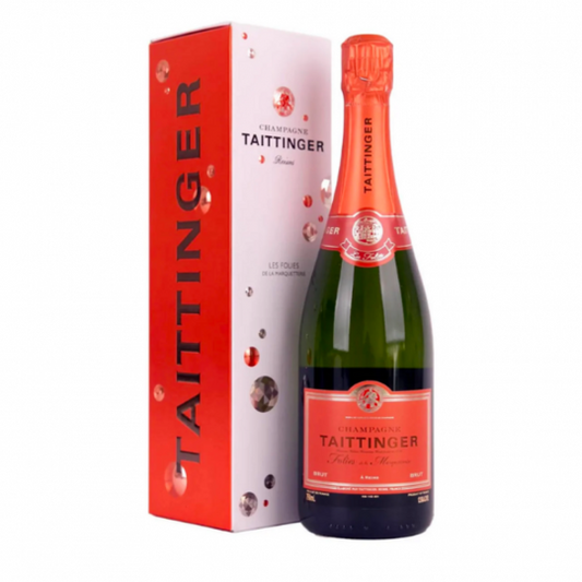 Paramount champagne bottle of Taittinger Les Folies de la Marquetterie Brut NV with a gold foil label and elegant glass.