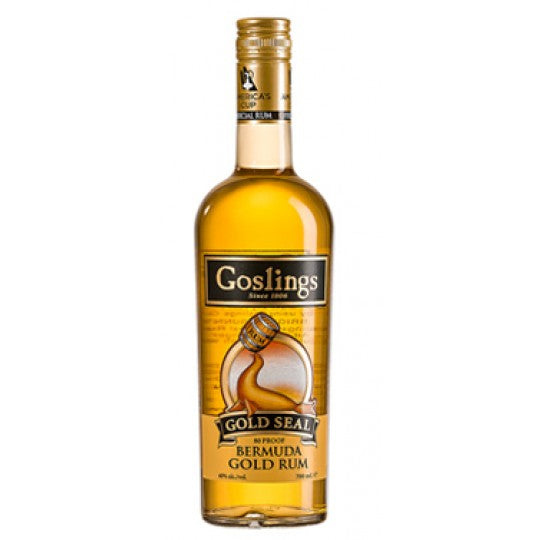 Paramount Goslings Gold Seal Rum 700ml dark rum bottle with gold seal label on a wooden surface.