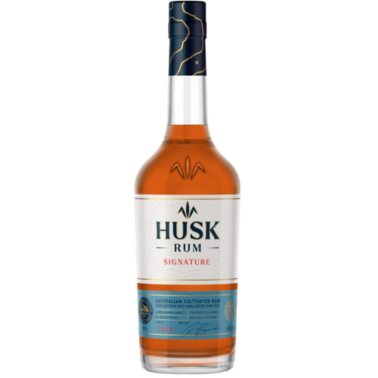 Paramount Husk Signature Australian Cultivated Rum 700ml bottle with label and clear glass, highlighting the premium liquor packaging
