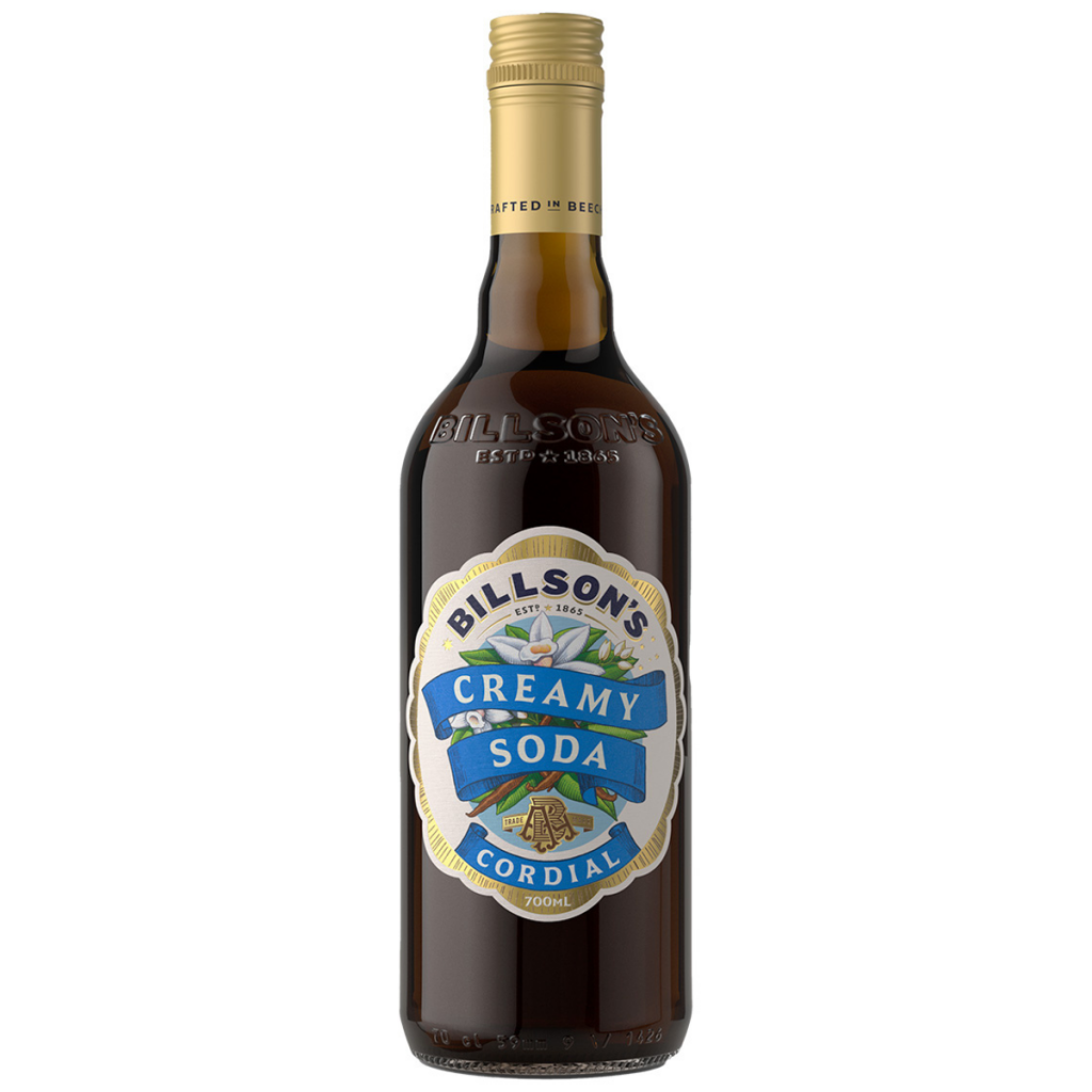 Six 700ml bottles of Billson's Creamy Soda cordial by Paramount, showing clear bottles filled with creamy soda flavor.