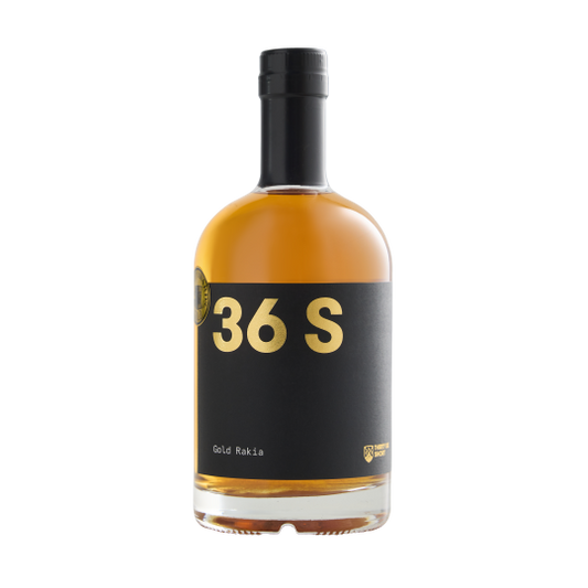 Bottle of Paramount 36 Short Gold Rakia flavored gin, 500ml, with golden label and clear glass showcasing the product.