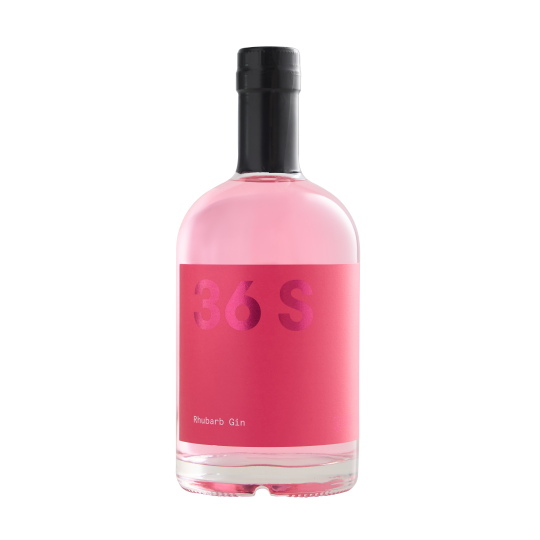 Bottle of Paramount 36 Short Rhubarb Flavored Gin in a 500mL bottle with a clear label and pinkish hue liquid inside.
