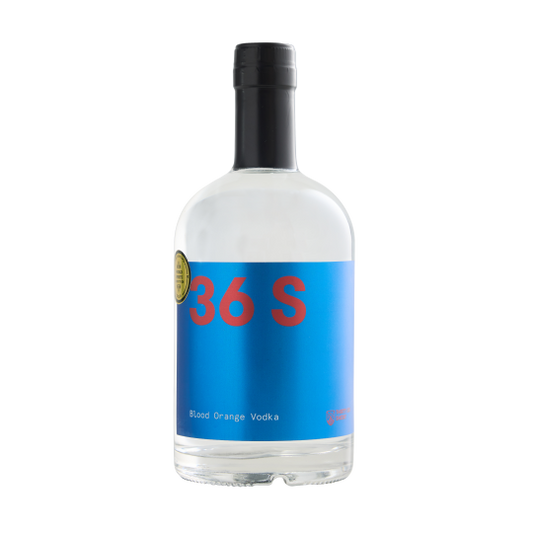 Bottle of Paramount 36 Short Blood Orange Flavored Vodka 500ml with vibrant orange liquid and label on clear glass bottle.