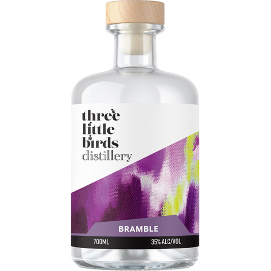 Bottle of Three Little Birds Distillery Bramble Gin by Paramount, 700ml, with a dark label and botanical illustrations.