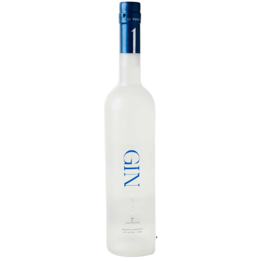 Bottle of 1st Pour Paramount International Gin, 700ml with clear label and elegant design, on a wooden surface.