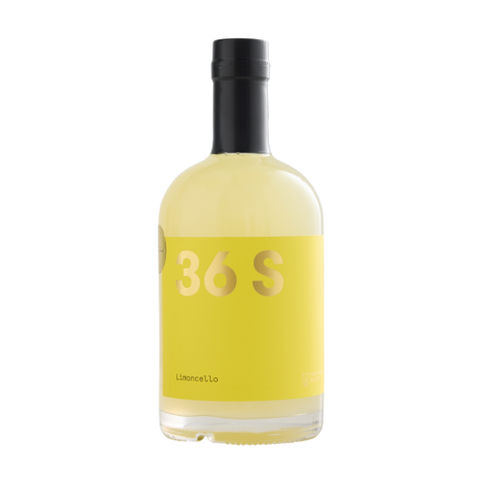 Bottle of Paramount 36 Short Limoncello in 500mL glass with bright yellow lemon label on clear bottle.