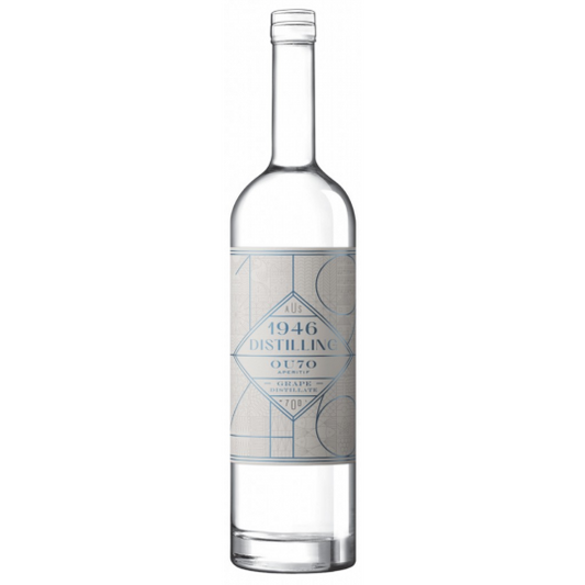 Paramount 1946 Distilling Ouzo 700ml bottle with label and clear glass, showcasing the traditional Greek anise-flavored spirit.