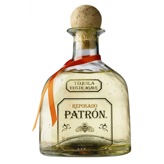 Bottle of Paramount Patron Reposado Tequila 700mL with amber color and label featuring Patron branding on a wooden surface.