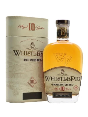 Paramount Whistle Pig 10-Year-Old Straight Rye Whiskey 700mL bottle with label and wooden cap on a wooden surface.