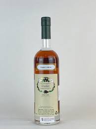 Paramount Willett Rye Whiskey 4 Year Old 700ml bottle with label and amber color liquid in a glass.