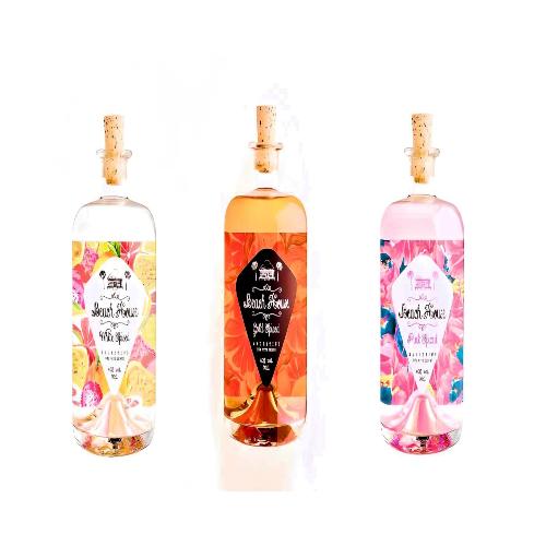 Paramount Beach House Spiced Rum Collection 700ml pack of 3 bottles, featuring tropical-inspired labels and dark amber rum.