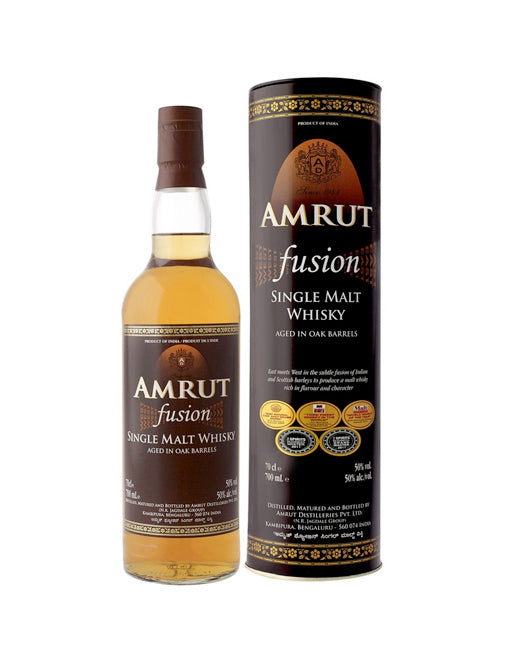 Amrut Single Malt Indian Whisky in a 700ml bottle, produced by Paramount, with a clear glass bottle and amber whisky inside.