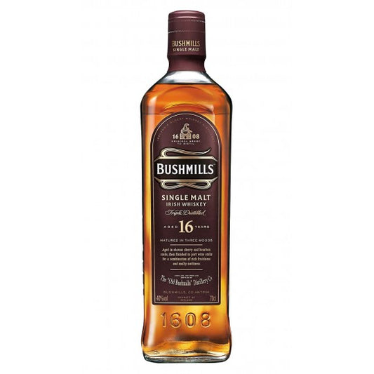 Bushmills 16 Year Old Irish Whiskey bottle by Paramount, 700ml, with dark label and branded cap.