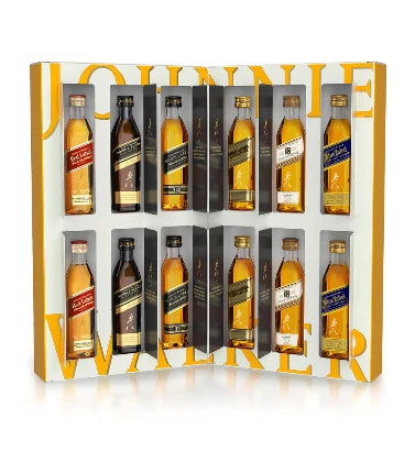 Johnnie Walker 12 Days of Discovery Whisky Advent Calendar by Paramount, featuring 12 miniature whisky bottles in a festive package.